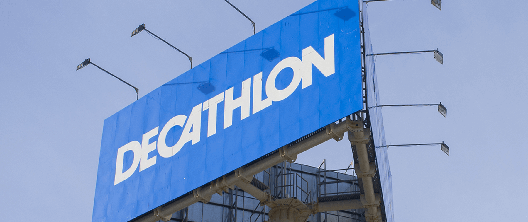 A low shot of the Decathlon logo on a blue sign